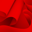 An abstract, dynamic composition of curved, intertwining red shapes reminiscent of rolls of paper – a teaser image for the media library.